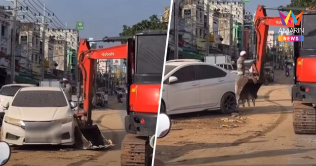 แชร์สนั่น! ตร.ใช้รถแบ็กโฮดันซากรถน้ำท่วม ชาวเน็ตถล่มซ้ำเติมความเสียหาย